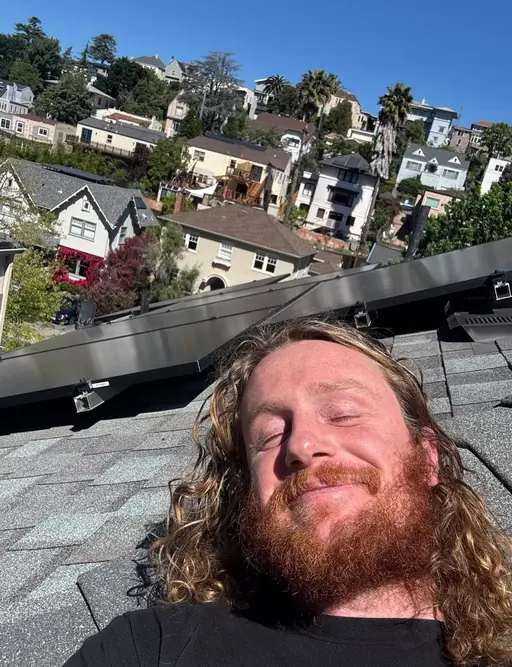 Isaac on a rooftop solar install in the Oakland hills