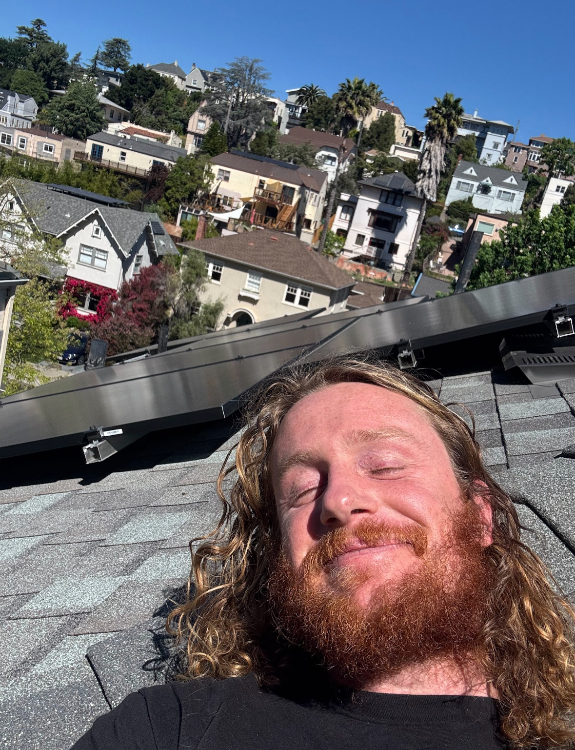 Isaac on a rooftop solar install in the Oakland hills